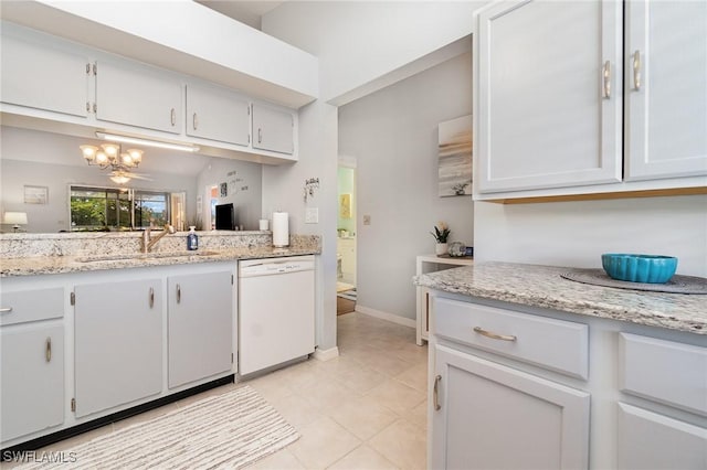 13090 Cross Creek Ct Unit 210, Fort Myers, FL 33912 - kitchen with dishwasher, light tile patterned flooring, a chandelier, white cabinetry, and light stone counters