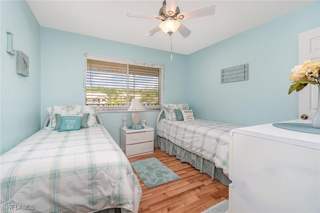 13090 Cross Creek Ct Unit 210, Fort Myers, FL 33912 - bedroom with wood finished floors, washer / dryer, and ceiling fan