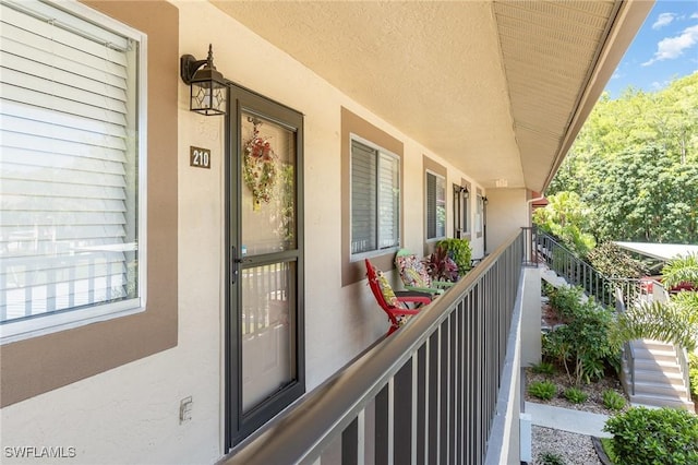 13090 Cross Creek Ct Unit 210, Fort Myers, FL 33912 - property entrance featuring stucco siding and a balcony