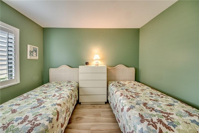 bedroom featuring wood finished floors