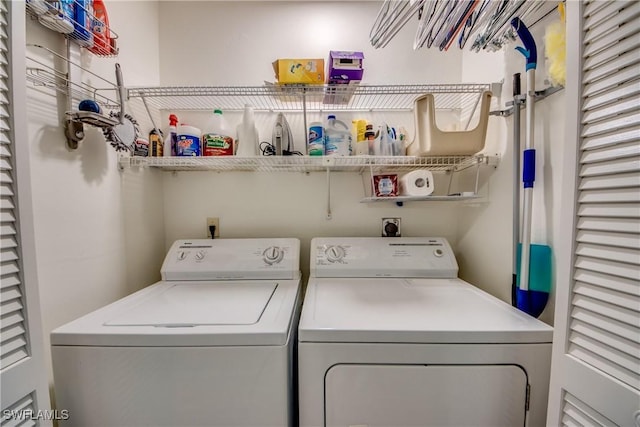 laundry area with separate washer and dryer