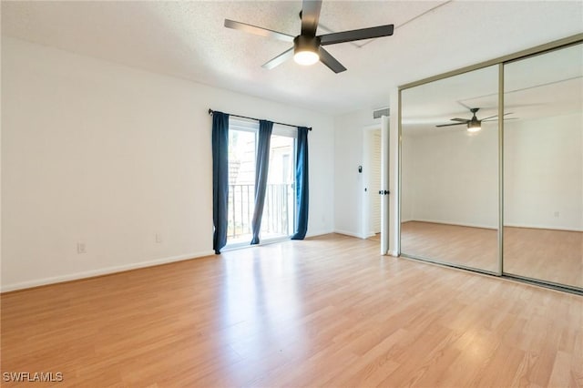 1428 Park Shore Cir Unit 2, Fort Myers, FL 33901 - unfurnished bedroom with light wood-style floors, ceiling fan, baseboards, and access to exterior