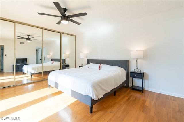 1428 Park Shore Cir Unit 2, Fort Myers, FL 33901 - bedroom featuring a closet, wood finished floors, ceiling fan, and baseboards