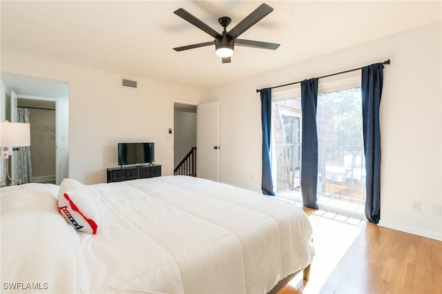 1428 Park Shore Cir Unit 2, Fort Myers, FL 33901 - bedroom featuring access to exterior, wood finished floors, baseboards, and ceiling fan