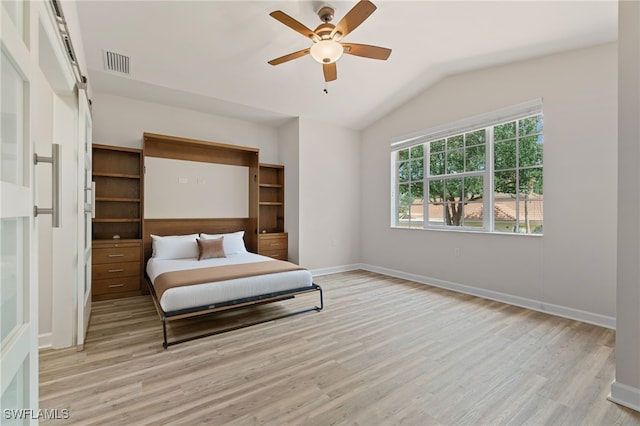 20290 Burnside Pl Unit 1102, Estero, FL 33928 - bedroom with light wood-style floors, vaulted ceiling, baseboards, and ceiling fan