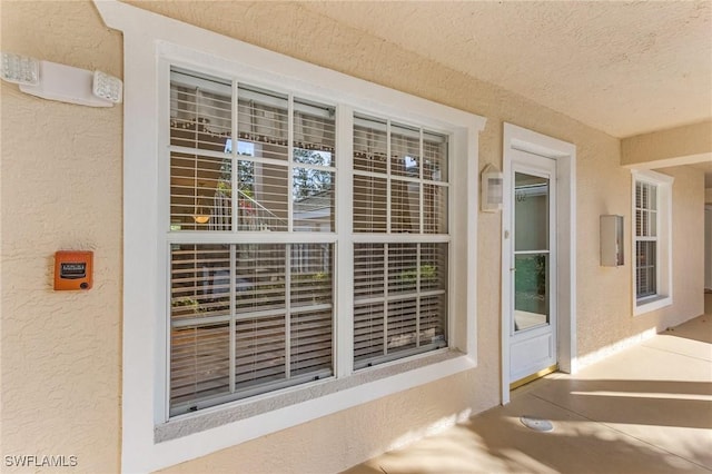 28881 Bermuda Lago Ct Unit 102, Bonita Springs, FL 34134 - doorway to property with stucco siding