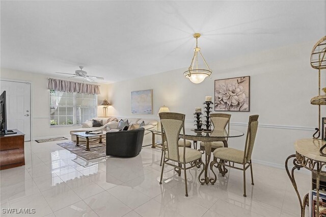 dining room featuring ceiling fan