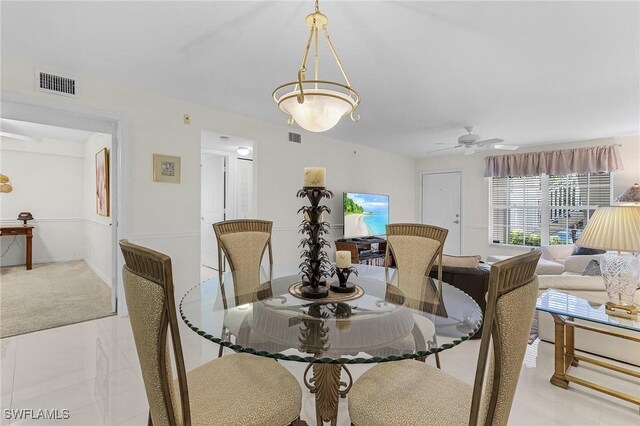 dining space featuring a ceiling fan