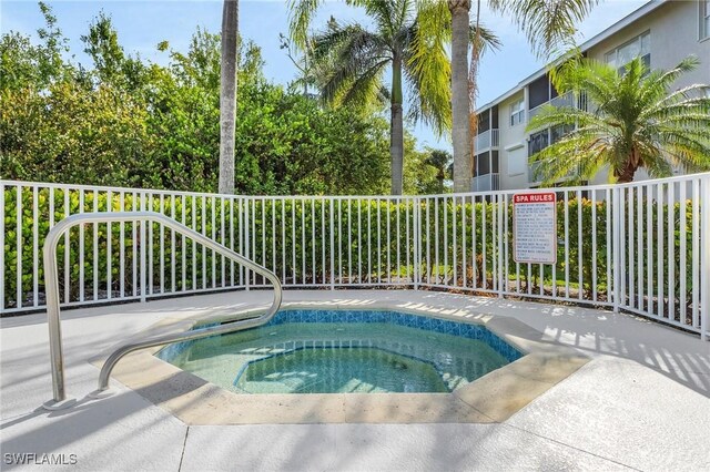 view of pool featuring a hot tub