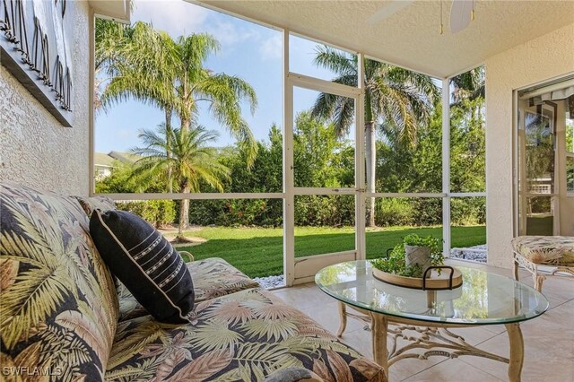 sunroom with a ceiling fan