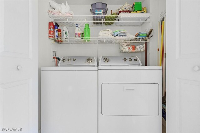 laundry room featuring washer and clothes dryer