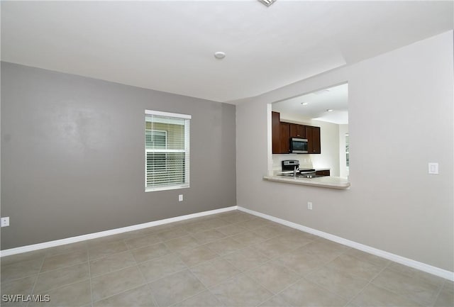 empty room with baseboards