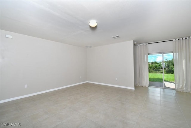 spare room with baseboards