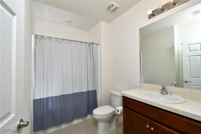 bathroom featuring toilet, tile patterned floors, vanity, and a shower with shower curtain