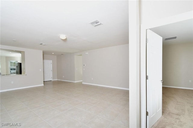 spare room with baseboards