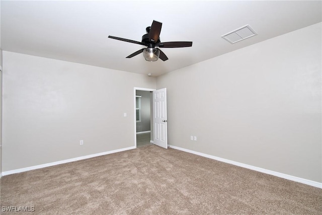 unfurnished room featuring ceiling fan, carpet floors, and baseboards