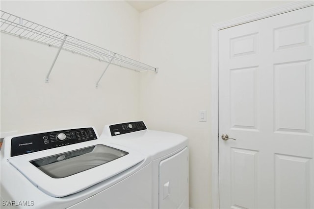 laundry room with independent washer and dryer
