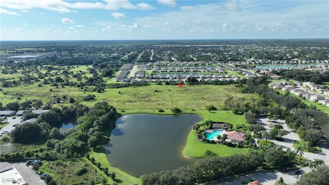 view of property location featuring a nearby body of water and nearby suburban area