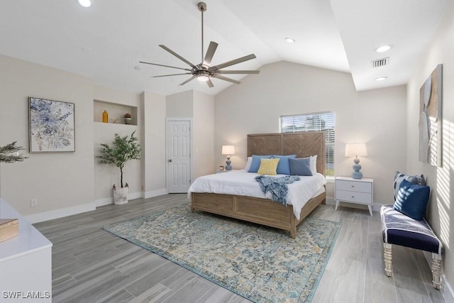 bedroom with vaulted ceiling, wood finished floors, a ceiling fan, recessed lighting, and baseboards