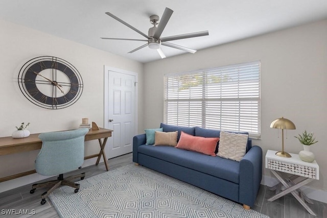 office space with ceiling fan and wood finished floors
