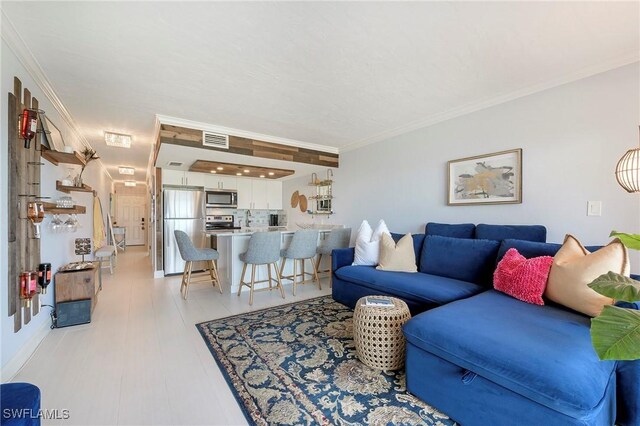 260 Southbay Dr Unit 102, Naples, FL 34108 - living room with ornamental molding