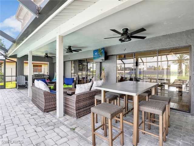 view of patio / terrace featuring ceiling fan, outdoor lounge area, fence, and outdoor dining space