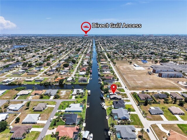 aerial perspective of suburban area featuring a large body of water