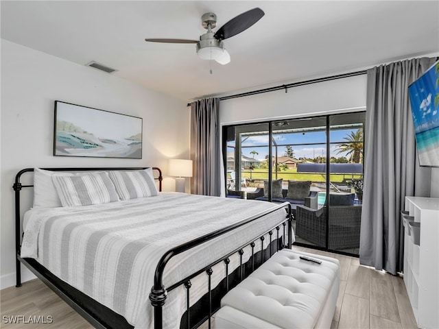 bedroom featuring access to exterior, light wood-style flooring, and a ceiling fan