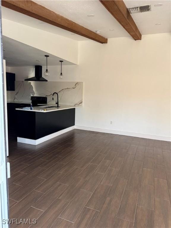 6321 Royal Woods Dr, Fort Myers, FL 33908 - kitchen featuring ventilation hood, beam ceiling, dark wood-style flooring, light countertops, and baseboards