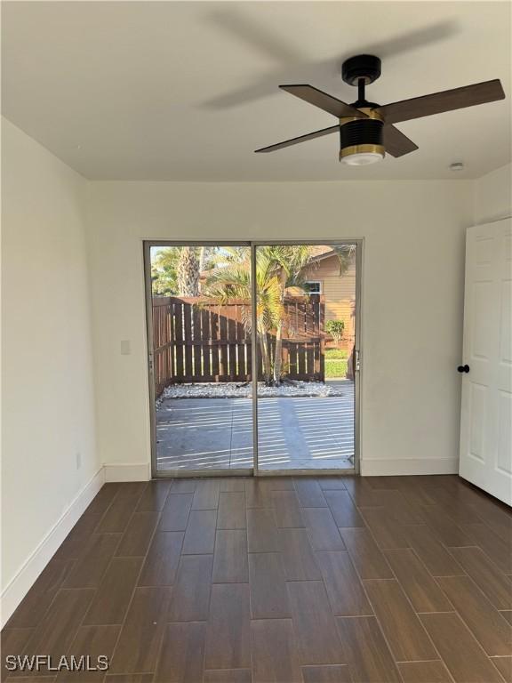 6321 Royal Woods Dr, Fort Myers, FL 33908 - empty room featuring wood tiled floors, baseboards, and ceiling fan