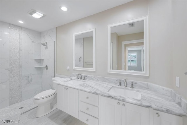 3613 Exuma Way, Naples, FL 34119 - full bathroom with toilet, a marble finish shower, double vanity, and recessed lighting