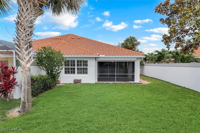 3613 Exuma Way, Naples, FL 34119 - back of house featuring stucco siding, a tiled roof, and a sunroom