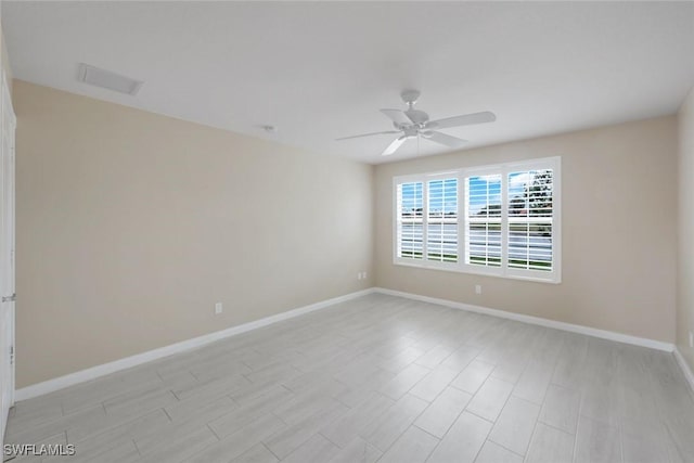 3613 Exuma Way, Naples, FL 34119 - spare room with a ceiling fan, baseboards, and light wood-style flooring