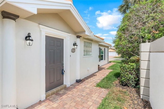 3613 Exuma Way, Naples, FL 34119 - view of exterior entry featuring stucco siding