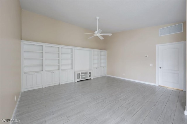3613 Exuma Way, Naples, FL 34119 - empty room with a ceiling fan, baseboards, light wood-type flooring, and lofted ceiling