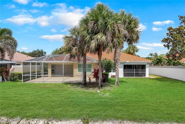 3613 Exuma Way, Naples, FL 34119 - back of house featuring stucco siding, a patio area, and a lanai