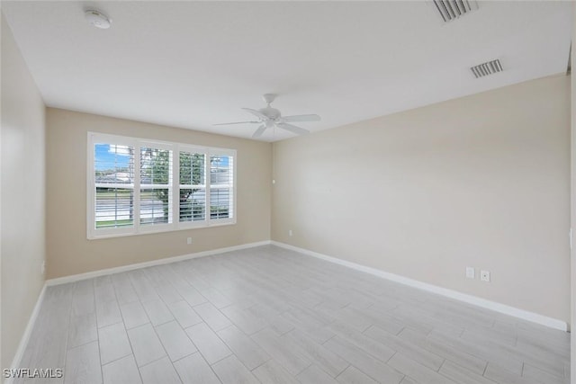 3613 Exuma Way, Naples, FL 34119 - empty room featuring a ceiling fan, baseboards, a smoke detector, and light wood-style floors