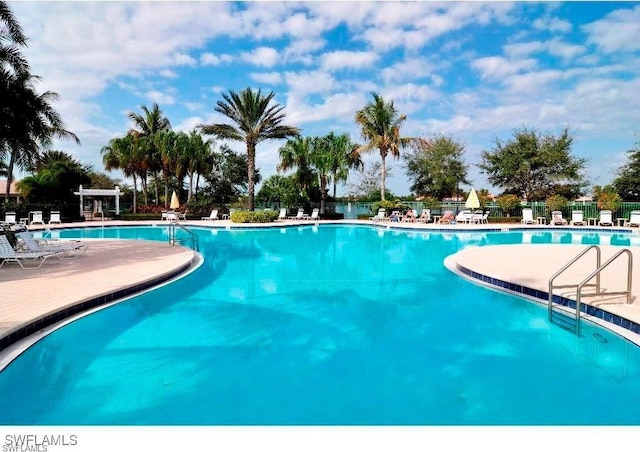 3613 Exuma Way, Naples, FL 34119 - community pool with a patio and fence