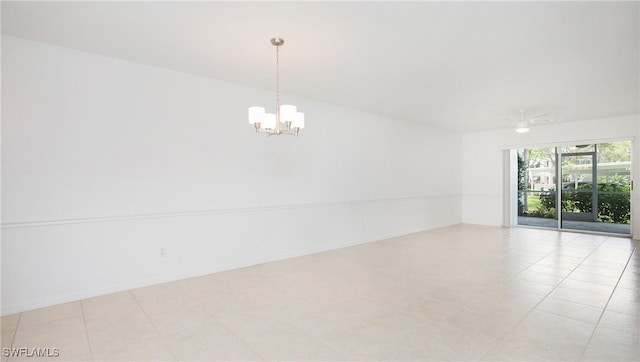 spare room with a chandelier and a ceiling fan
