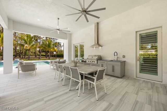 6145 Sea Grass Ln, Naples, FL 34116 - view of patio with a sink, an outdoor kitchen, grilling area, outdoor dining area, and a ceiling fan