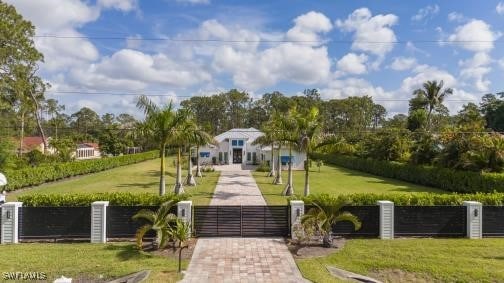 6145 Sea Grass Ln, Naples, FL 34116 - view of community with a gate