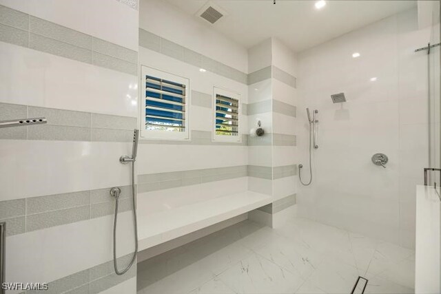 6145 Sea Grass Ln, Naples, FL 34116 - bathroom featuring marble finish floors and a tile shower