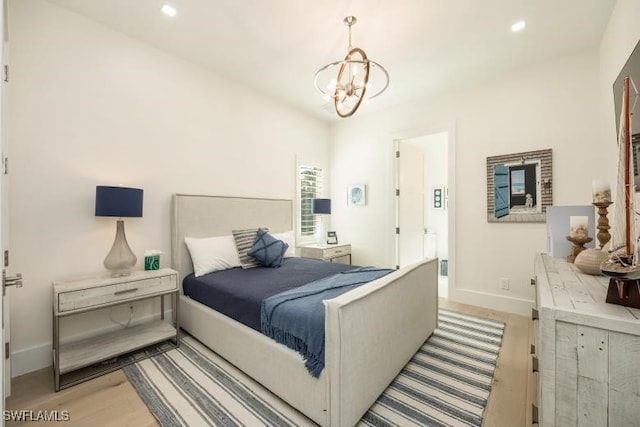 6145 Sea Grass Ln, Naples, FL 34116 - bedroom with light wood-style floors, a chandelier, baseboards, and recessed lighting