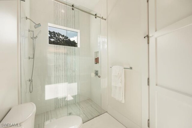 6145 Sea Grass Ln, Naples, FL 34116 - full bathroom featuring toilet, a shower stall, and tile patterned flooring