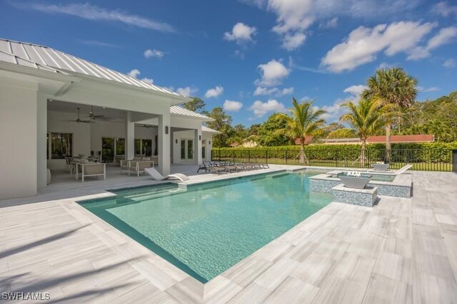 6145 Sea Grass Ln, Naples, FL 34116 - view of pool with an in-ground hot tub, fence, ceiling fan, and a patio