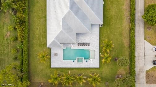 6145 Sea Grass Ln, Naples, FL 34116 - view of subject property featuring a pool area