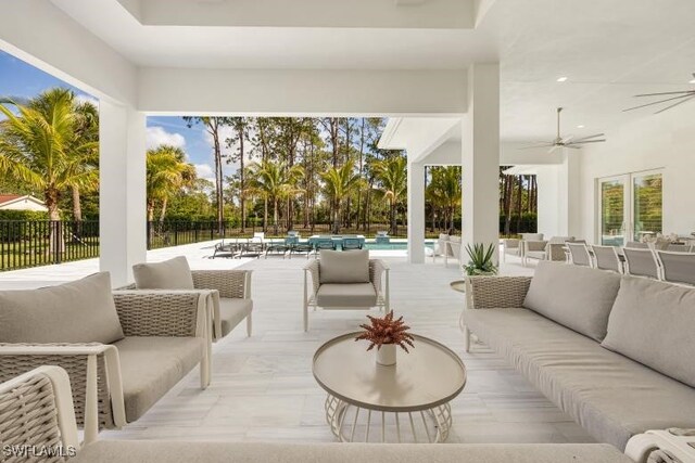 6145 Sea Grass Ln, Naples, FL 34116 - view of patio with outdoor lounge area, ceiling fan, and fence