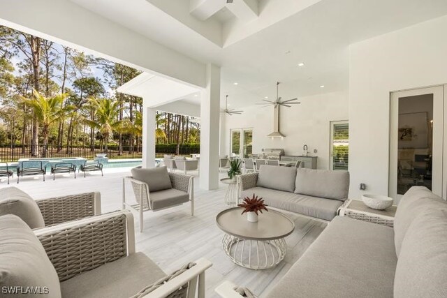 6145 Sea Grass Ln, Naples, FL 34116 - view of patio / terrace featuring outdoor lounge area, a ceiling fan, exterior kitchen, fence, and french doors