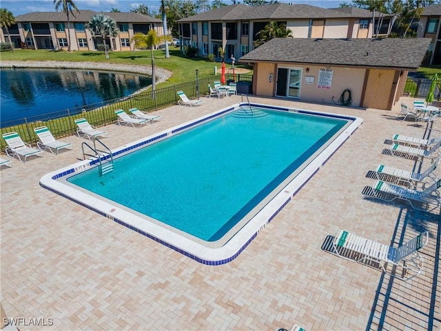 16881 Davis Rd Unit 412, Fort Myers, FL 33908 - community pool with a patio, a water view, and a residential view
