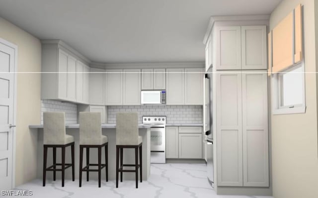 16881 Davis Rd Unit 412, Fort Myers, FL 33908 - kitchen featuring white microwave, stove, a breakfast bar area, backsplash, and light countertops
